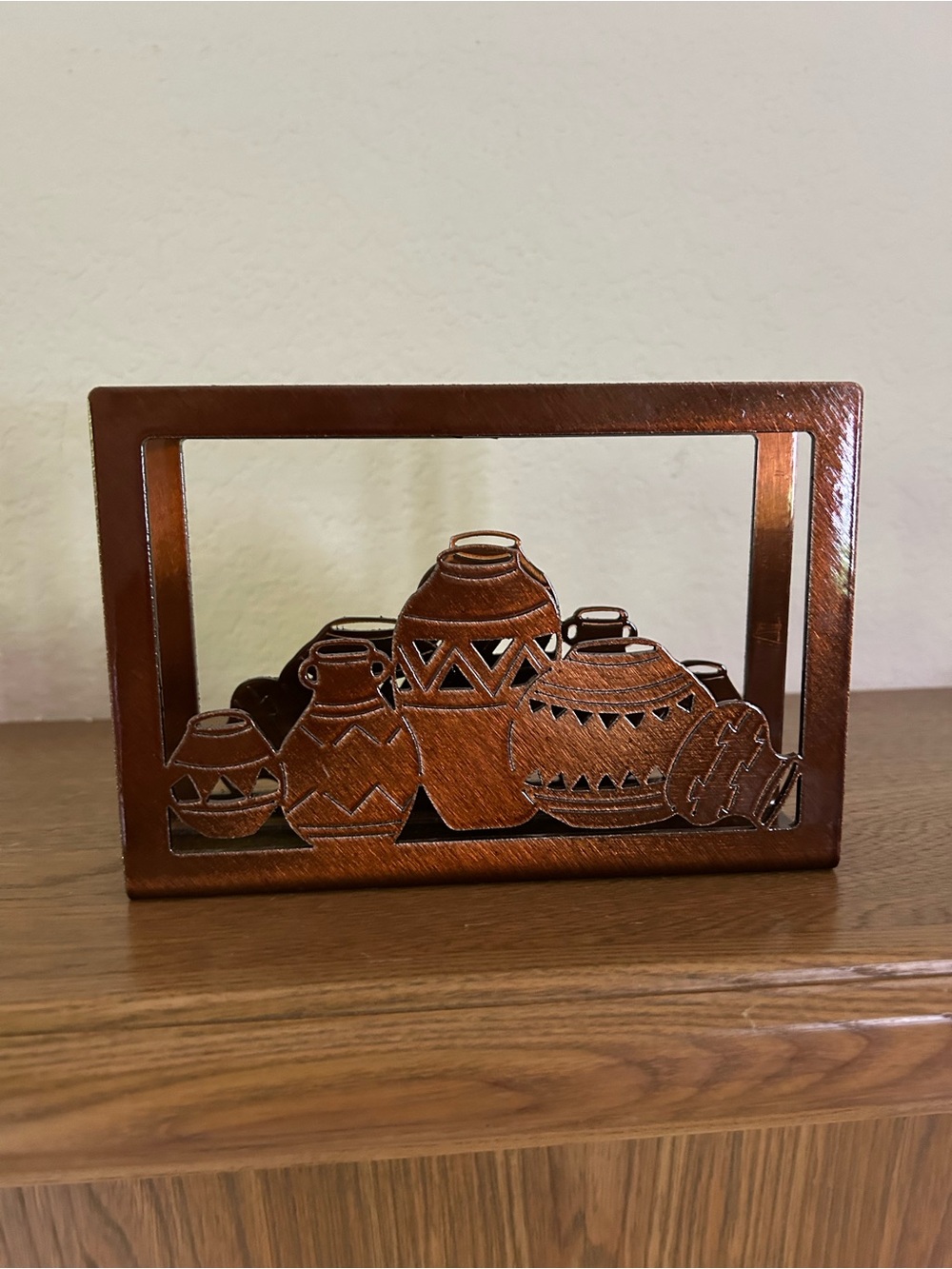 Native American Decorative Napkin holder. Vases silhouette rustic metal surface